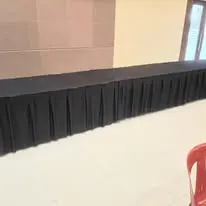 Long table with black table skirting in hall