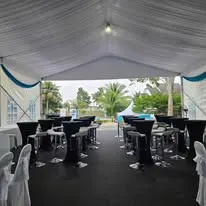 Canopy cocktail table setup with black covers
