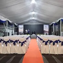 Canopy seminar chairs with blue sash and stage