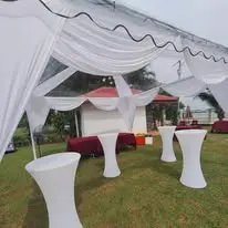 Outdoor cocktail table covers under canopy