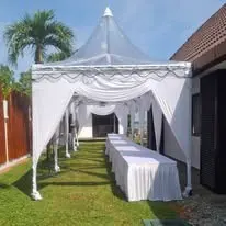 Garden canopy with long tables and white table cloth
