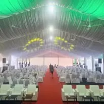 Marquee audience chair layout with red carpet aisle
