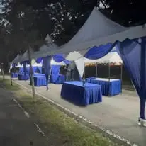 Night blue canopy setup with long tables