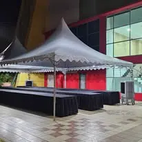 Pagoda canopy setup with black skirt tables