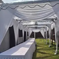 White canopy long table service setup